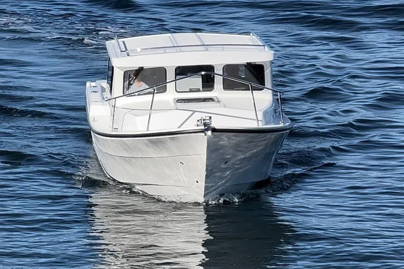 Slide: The Image of 2026 Sea Sport XL 2400 boat cruising on open water. - 3