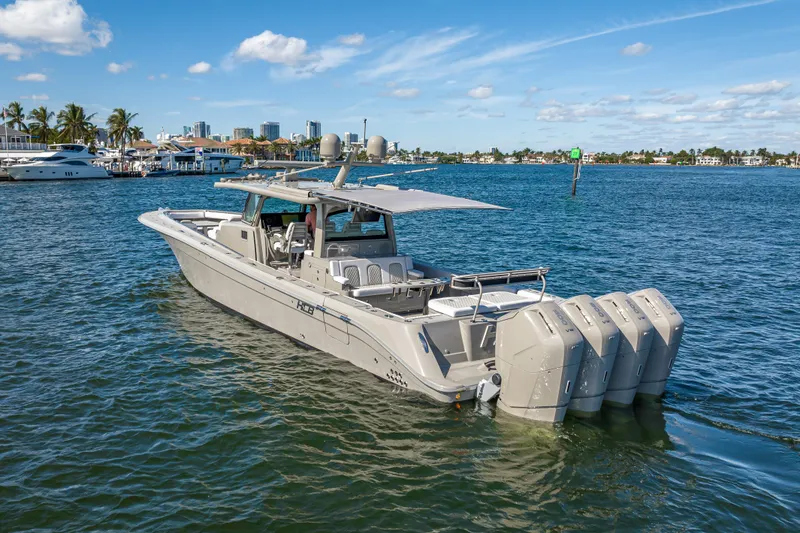 Slide: The Image of 2024 HCB 53 Suenos luxury boat with multiple engines on a sunny day. - 10