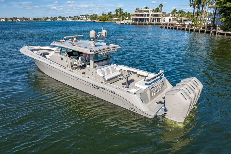 Slide: The Image of 2024 HCB 53 Suenos luxury boat cruising on a sunny waterfront. - 18