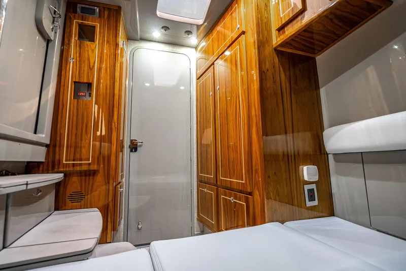 Slide: The Image of Luxurious interior of 2024 HCB 53 Suenos boat with wood paneling and modern amenities. - 26