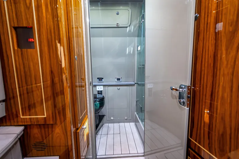 Slide: The Image of Luxurious bathroom interior of 2024 HCB 53 Suenos yacht with wood accents and modern fixtures. - 27