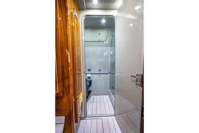 Slide: The Image of Luxurious interior of 2024 HCB 53 Suenos yacht featuring sleek wood finishes and modern design. - 28