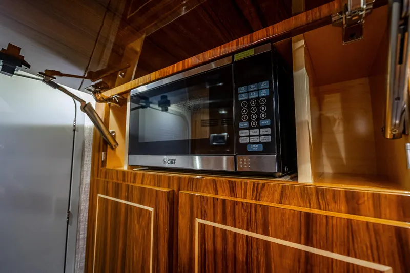 Slide: The Image of Built-in microwave in 2024 HCB 53 Suenos yacht's wooden cabinetry. - 33