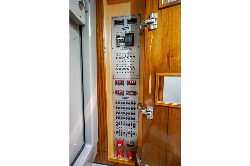 Slide: The Image of Control panel of 2024 HCB 53 Suenos boat with digital displays and switches. - 34