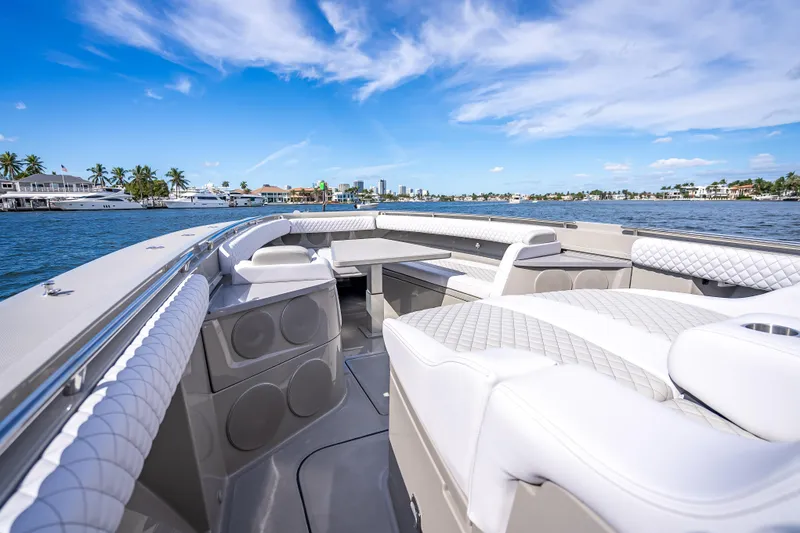 Slide: The Image of Luxurious 2024 HCB 53 Suenos boat interior with plush seating, cruising on a sunny day. - 36