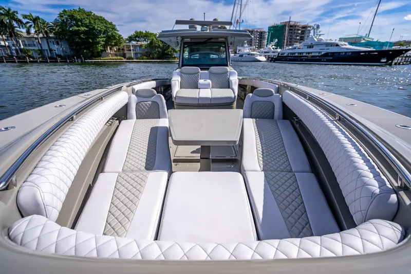Slide: The Image of Luxurious 2024 HCB 53 Suenos boat interior with elegant white seating and table. - 38