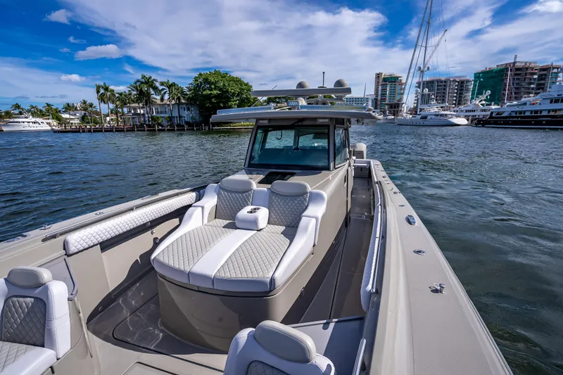 Slide: The Image of 2024 HCB 53 Suenos luxury boat on water with cityscape background. - 40