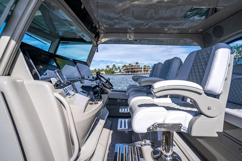 Slide: The Image of Interior of 2024 HCB 53 Suenos boat with luxurious seating and advanced controls. - 48