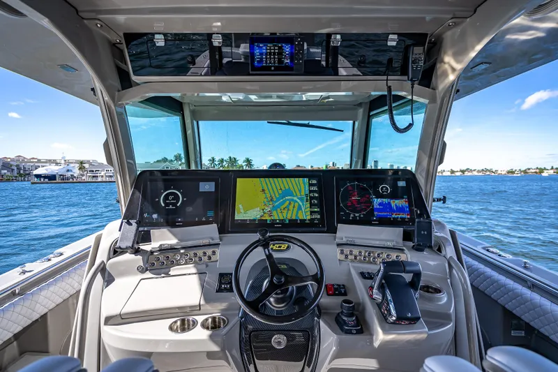Slide: The Image of 2024 HCB 53 Suenos helm with advanced navigation displays on a sunny day. - 51