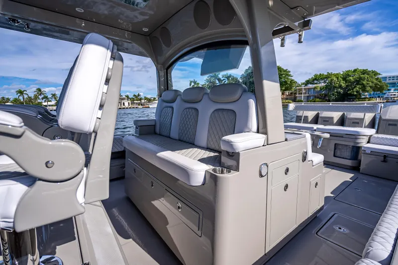 Slide: The Image of 2024 HCB 53 Suenos luxury boat interior with plush seating and modern design. - 54