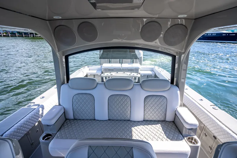 Slide: The Image of Luxurious interior of 2024 HCB 53 Suenos boat with quilted seating and ocean view. - 55