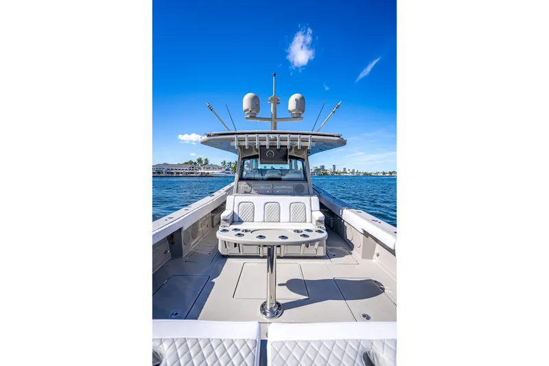 Slide: The Image of 2024 HCB 53 Suenos boat on water, featuring spacious deck and modern design. - 65