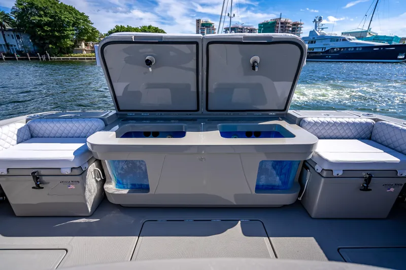 Slide: The Image of 2024 HCB 53 Suenos boat interior with open storage compartments and seating. - 70