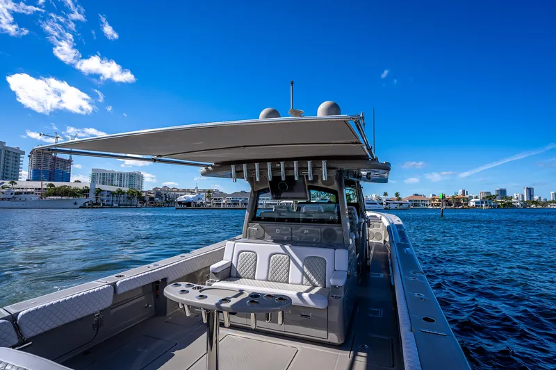 Slide: The Image of 2024 HCB 53 Suenos boat on water, featuring spacious deck and modern design. - 75