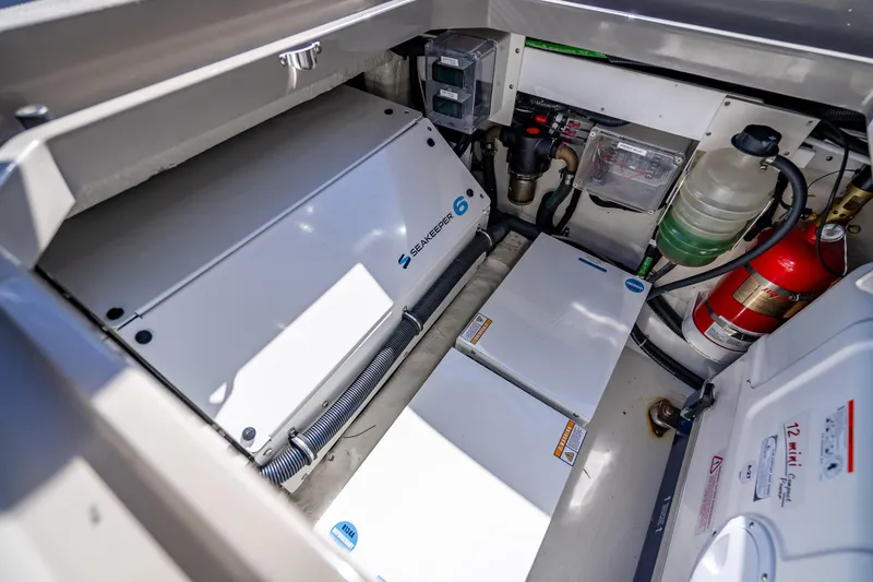 Slide: The Image of Engine room of 2024 HCB 53 Suenos featuring Seakeeper 6 stabilizer and safety equipment. - 79