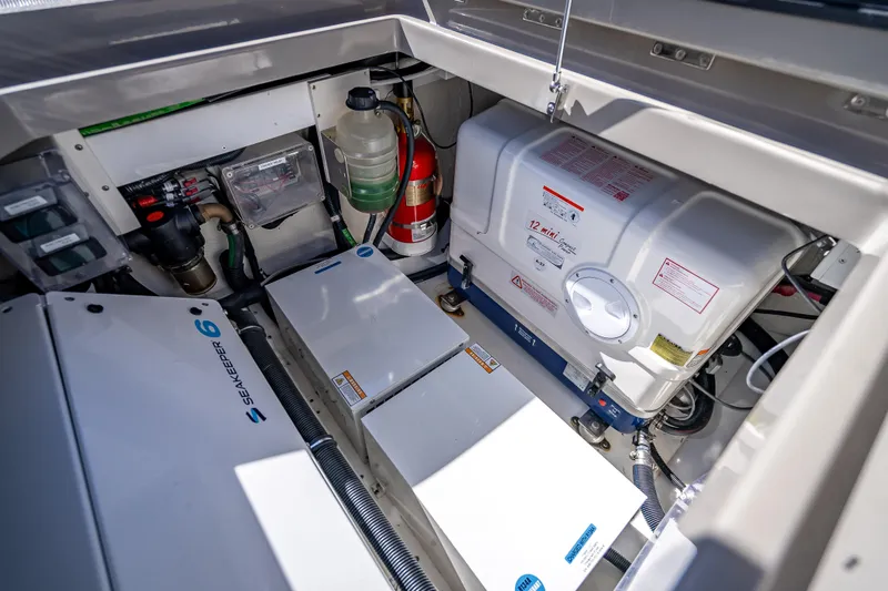 Slide: The Image of Engine compartment of 2024 HCB 53 Suenos, featuring Seakeeper 6 stabilizer and safety equipment. - 80