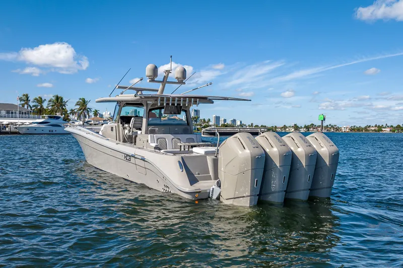 Slide: The Image of 2024 HCB 53 Suenos boat with four engines on a sunny day. - 9