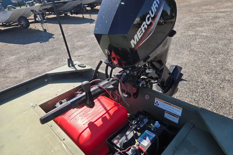 Slide: The Image of 2023 SeaArk 1648 MV boat with Mercury outboard motor and fuel tank. - 11