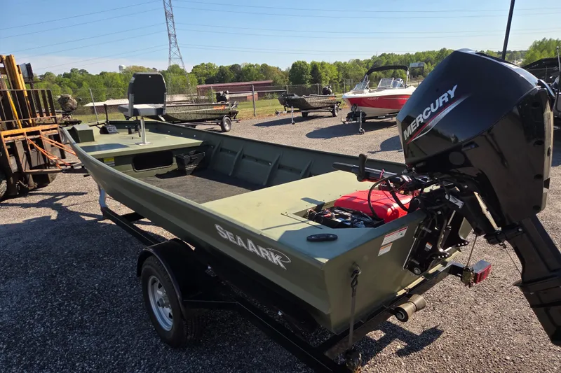 Slide: The Image of 2023 SeaArk 1648 MV boat with Mercury engine on trailer in outdoor setting. - 3