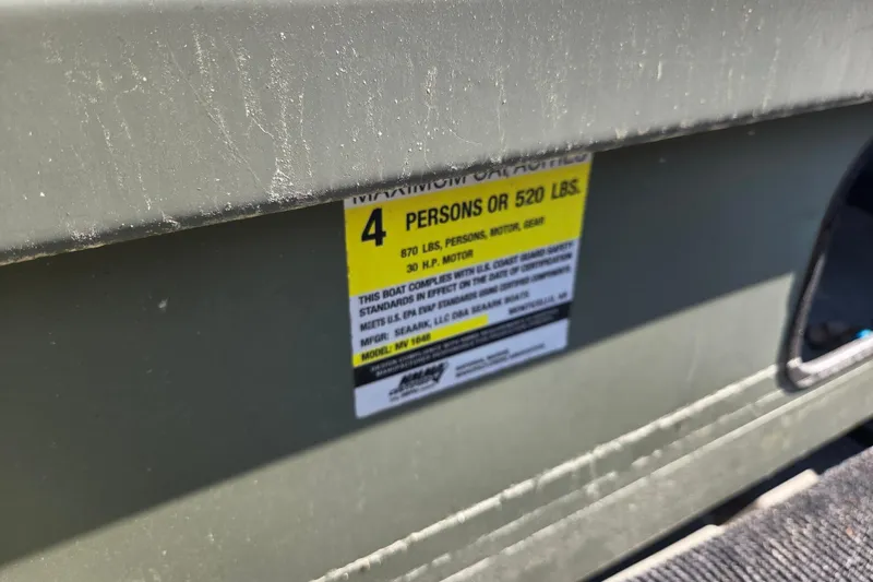 Slide: The Image of 2023 SeaArk 1648 MV boat capacity label, indicating maximum of 4 persons or 520 lbs. - 5