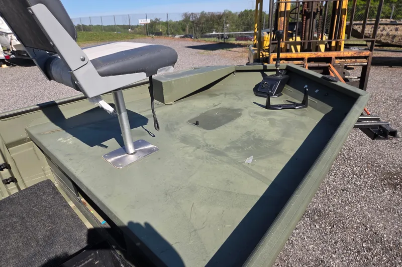 Slide: The Image of 2023 SeaArk 1648 MV boat deck with seat and control panel. - 7