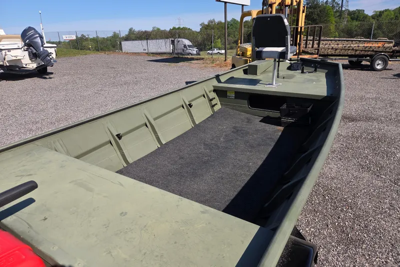 Slide: The Image of 2023 SeaArk 1648 MV boat with spacious interior and outdoor setting. - 8