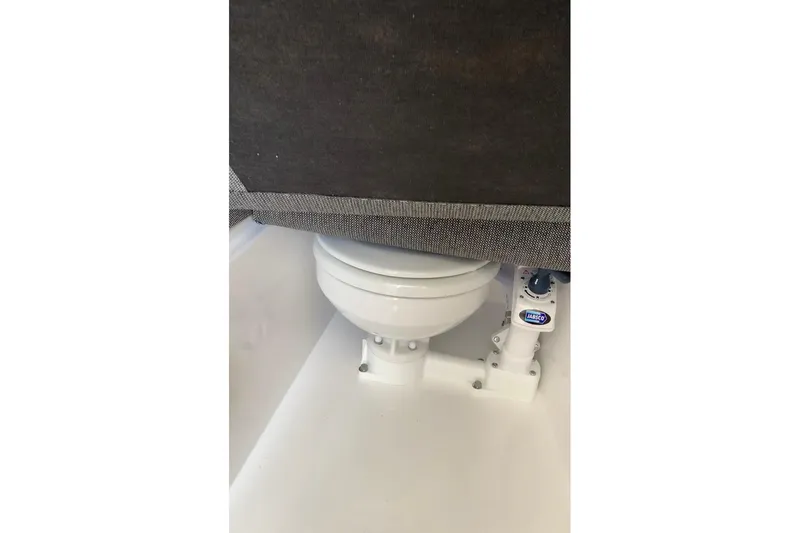 Slide: The Image of Marine toilet in 2026 Sea Sport Kenai 2600 boat, featuring Jabsco pump system. - 11