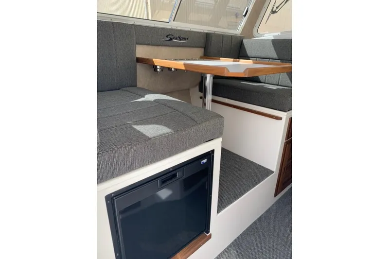 Slide: The Image of Interior of 2026 Sea Sport Kenai 2600 boat with seating and table. - 14