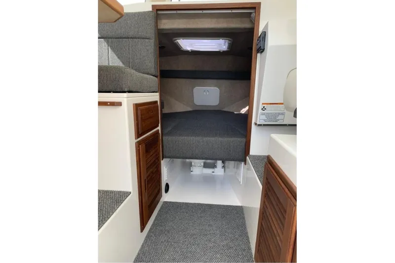 Slide: The Image of Interior cabin of 2026 Sea Sport Kenai 2600 boat with cozy sleeping area. - 7