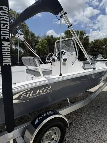 The Image of ALK2 Powerboats 22CRS 2026 on trailer, blue sky, palm trees in background. - 1