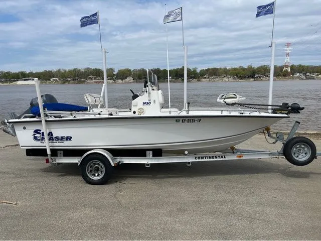 Slide: The Image of 2005 Sea Chaser 1950 RG boat on trailer by riverside. - 4