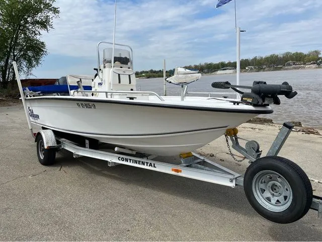 Slide: The Image of 2005 Sea Chaser 1950 RG boat on trailer by riverside. - 8