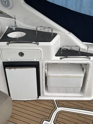 Slide: The Image of 2014 Regal Express Cruiser 30 with sink and refrigerator. - 11