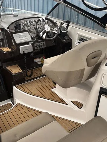 Slide: The Image of Interior of a 2014 Regal Express Cruiser 30 with modern helm console. - 12