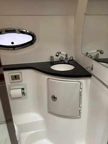 Slide: The Image of Bathroom in 2014 Regal Express Cruiser 30 with sink and mirror. - 25
