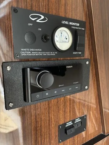 Slide: The Image of Regal Express Cruiser 30, 2014: Freshwater tank monitor and Fusion audio system. - 26