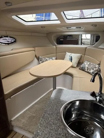 Slide: The Image of Interior of 2014 Regal Express Cruiser 30 with cozy seating area. - 27