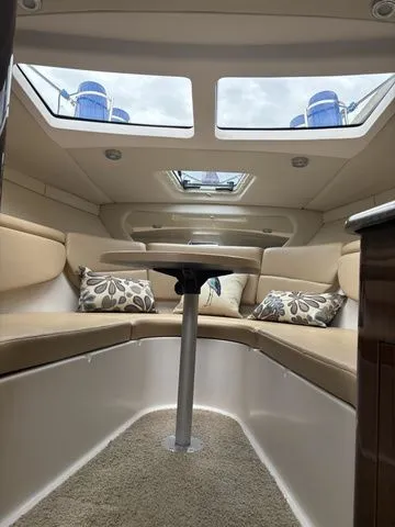 Slide: The Image of Interior of a 2014 Regal Express Cruiser 30 with seating area. - 30