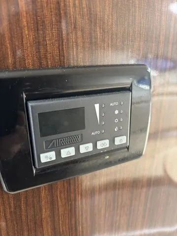 Slide: The Image of Regal Express Cruiser 30 2014 control panel on wood finish. - 33