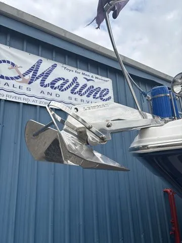 Slide: The Image of Regal Express Cruiser 30 anchor in front of blue building, year 2014. - 39