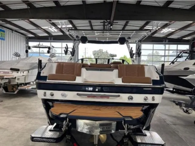 Slide: The Image of 2026 Malibu Wakesetter 24 MXZ boat in warehouse. - 4