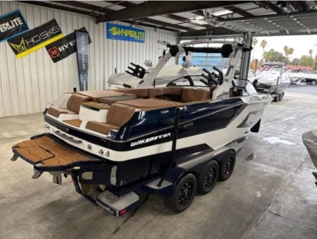 Slide: The Image of 2026 Malibu Wakesetter 24 MXZ boat in a warehouse. - 5