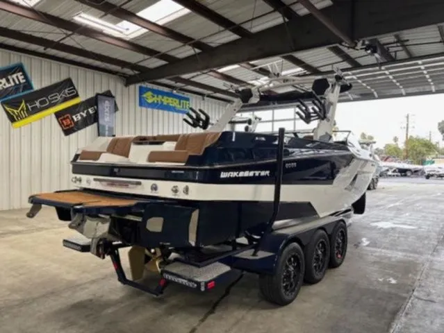 Slide: The Image of 2026 Malibu Wakesetter 24 MXZ boat in warehouse. - 7