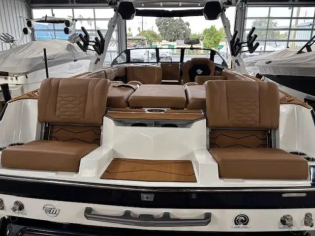 Slide: The Image of 2026 Malibu Wakesetter 24 MXZ with luxurious interior seating. - 8