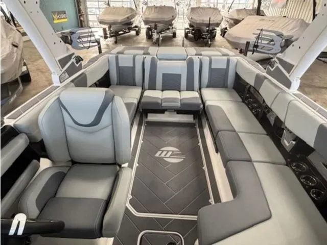 Slide: The Image of 2026 Malibu Wakesetter 23 LSV interior with gray upholstery. - 10