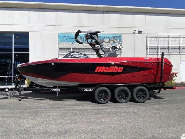 The Image of 2026 Malibu Wakesetter 25 LSV boat in red on trailer. - 1