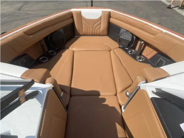Slide: The Image of Interior of 2026 Malibu Wakesetter 25 LSV with brown leather seating. - 10