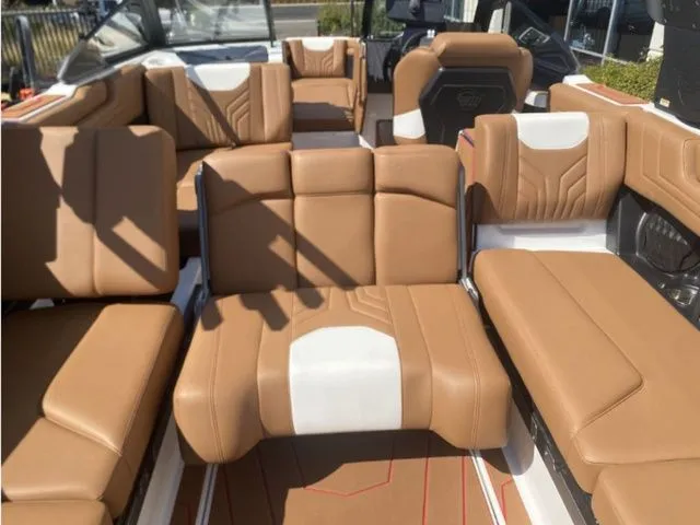 Slide: The Image of Interior of 2026 Malibu Wakesetter 25 LSV with brown leather seating. - 13