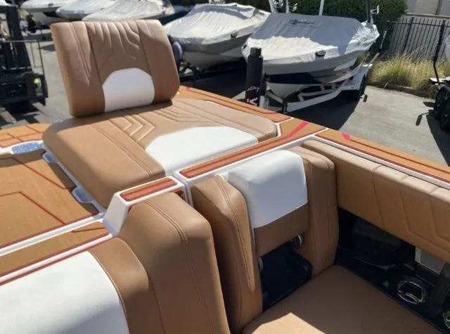Slide: The Image of Interior of 2026 Malibu Wakesetter 25 LSV with luxurious seating. - 16