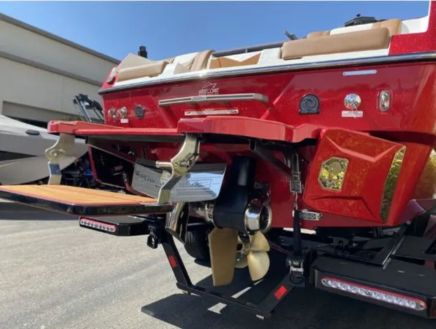 Slide: The Image of Red 2026 Malibu Wakesetter 25 LSV boat, rear view with propeller. - 6